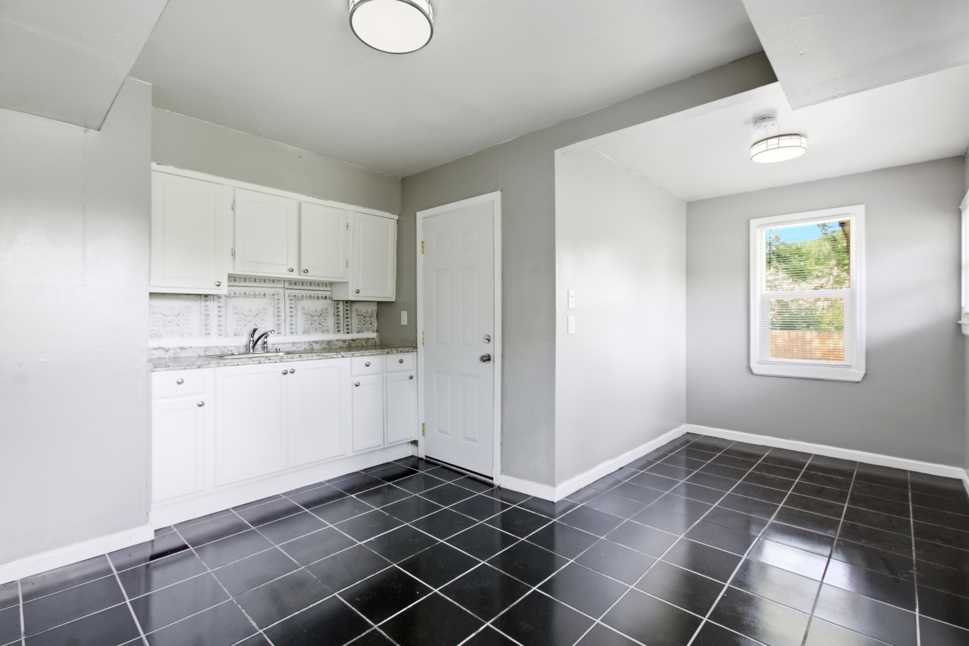 Clean kitchen with white cabinets