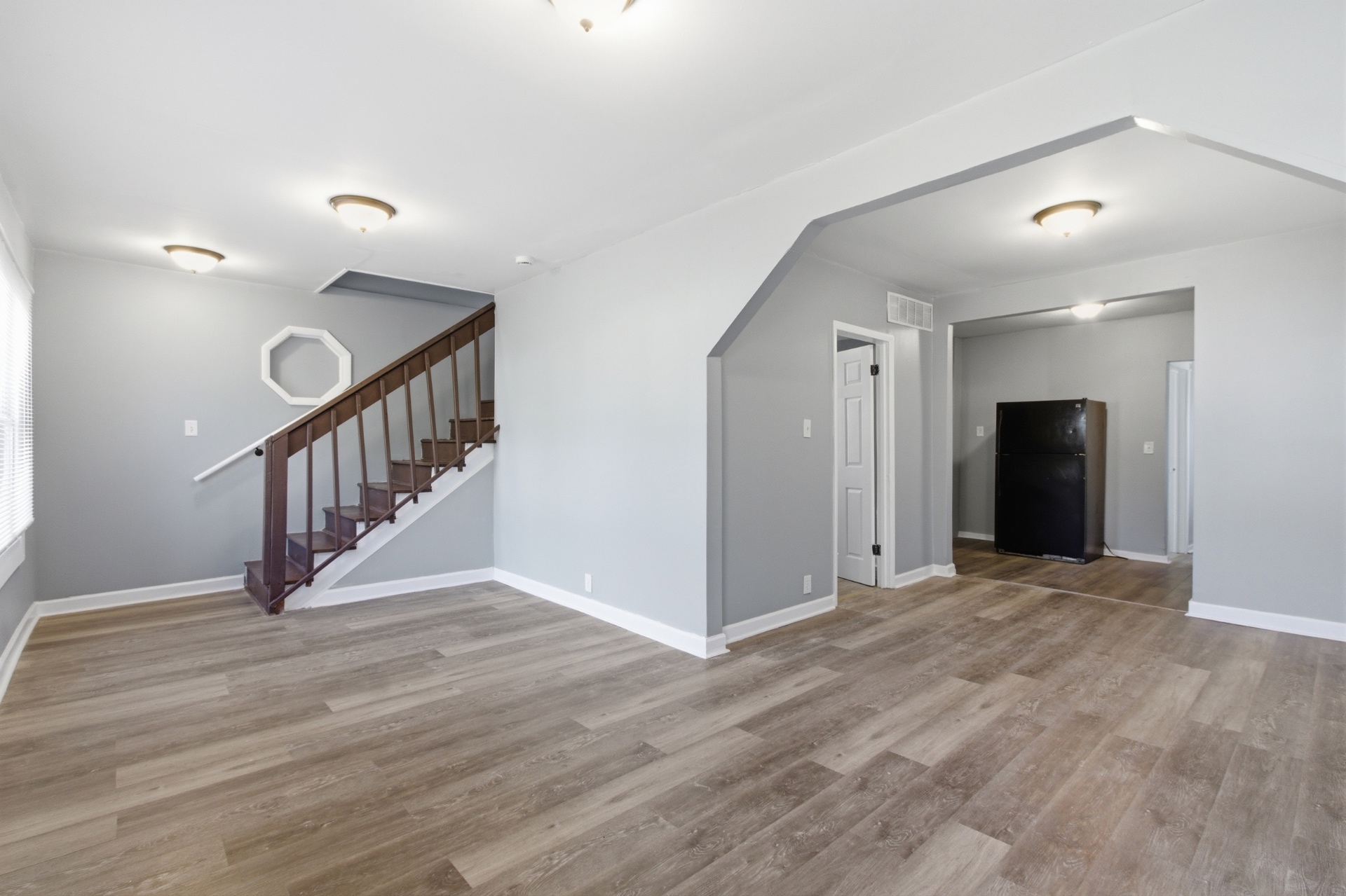 Bright open living room with wood floors